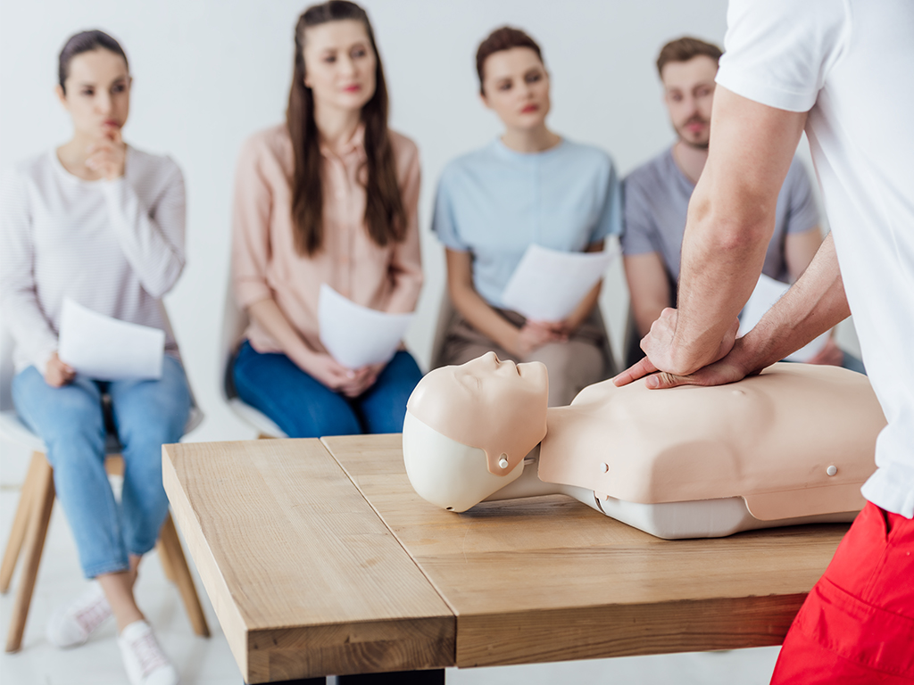 An image of a group of people getting trained on CPR in Houston Texas.